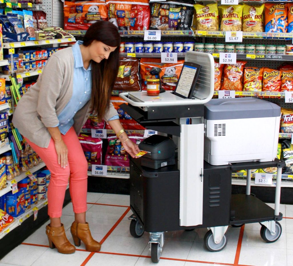 Employee using an RTI PowerCart in the aisle